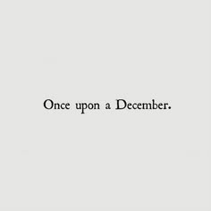 the words once upon a december written in black ink