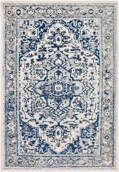 a blue and white rug with an ornate design on the bottom, in front of a white background