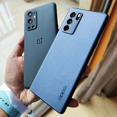 two oneplus phones are being held in their hands