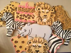 decorated cookies in the shape of animals and zebras