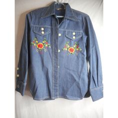 Vintage 60s 70s Floral Embroidered Shirt blue Denim by Blanquita - from an Estate apparently this brand was very popular at high end resorts - made in Mexico multicolored floral embroidered on front and back faux pocket flaps has cufflinks in the cuffs, not sure if they go with this or not, but since they came with it, I'm sending them along... they look like the old chrysler car logo Sz M / 36 no material tag but it has a lightweight denim feel to it, it could be a cotton blend, or some of the older polyester has a similar feel probably from the last 60's or 70's based on label cool vintage white buttons because of the age, I would hand wash this Approximate measurements: laying flat; 25 inches from center back to bottom of shirt waist; 18 inches from armpit to armpit this could be worn a Vintage Medium Wash Tops For Spring, Retro Floral Embroidered Button-up Top, Fitted Embroidered Medium Wash Tops, Retro Long Sleeve Top With Floral Embroidery, Vintage Blue Embroidered Top, Vintage Denim Tops For Spring, Retro Medium Wash Tops For Spring, 1970s Button-up Spring Top, 1970s Style Button-up Spring Top