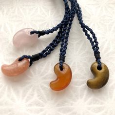 Experience the timeless elegance of our **Magatama Silk Braided Necklace handcrafted with exquisite Kyoto silk braiding. This versatile accessory, perfect for all ages and genders, is also a meaningful talisman. #### About the Magatama The **Magatama** is an ancient Japanese talisman, believed to date back to the Kofun period (3rd century). Revered as one of Japan's "Three Sacred Treasures", it has been cherished as a symbol of protection and good fortune throughout history. The unique shape of the Magatama, resembling the combined forms of the sun and moon, is also thought to represent a fang or a fetus. The hole in the Magatama symbolizes a connection with ancestors, who are believed to bring their blessings. Traditionally, it is also considered a charm for fertility and safe childbirth. Spiritual Handwoven Necklace For Gift, Handmade Silk Cord Necklaces As Gift, Handmade Silk Cord Necklace For Gifts, Holistic Hand Knotted Jewelry Gift, Traditional Hand Wrapped Necklaces As Gifts, Traditional Hand Wrapped Necklace As Gift, Spiritual Fair Trade Necklace As Gift, Amulet Style Necklace With Adjustable Cord For Meditation, Adjustable Amulet Necklace For Meditation