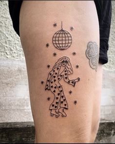 a woman's leg with a tattoo on it