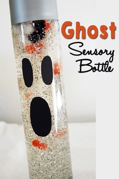 a ghost bottle with orange and black dots on it