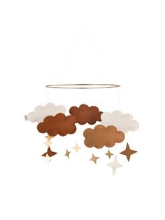 a mobile with stars and clouds hanging from it