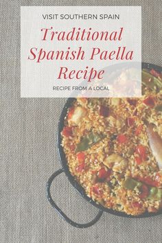 spanish paella recipe in a skillet with text overlay reading visit southern spain traditional spanish paella recipe