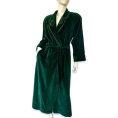 This beautiful green velvet robe from I. Magnin is the perfect addition to your winter wardrobe. The luxurious velour fabric and gold trim accent add a touch of elegance to this classic piece. Featuring a V-neckline, long sleeves with shoulder pads, and a tie closure, this vintage robe is both stylish and comfortable. Machine washable and made with a cotton blend, it is easy to care for and perfect for any occasion. Whether you're looking for a cozy robe to wear during the holidays or just lounging around the house, this I. Magnin robe is sure to become a favorite. This Robe is in very good condition! Shoulder to shoulder laying flat across 19" Pit to pit approximately 21" across Length from shoulder to hem 50" Sleeves length approximately 23" Cotton polyester blend Winter Robes, Closet Addition, Velour Fabric, 60s Dress, Womens Robes, Long Tunic, Sweaters Crewneck, Green Print, Green Velvet