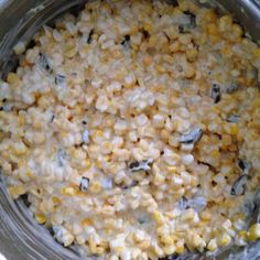 corn kernels are in a pot on the stove top, ready to be cooked