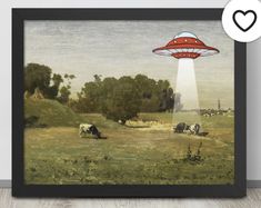 a painting on the wall with an image of a red flying saucer above it