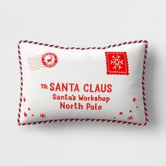 the santa clause pillow is on display