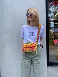 a woman standing in front of a store window