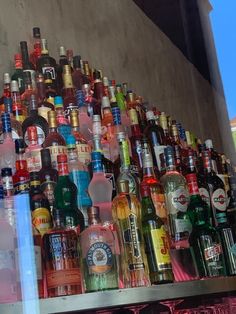 many different types of alcohol bottles on display