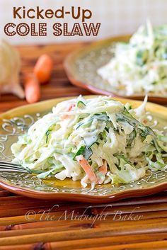 two plates filled with coleslaw on top of a wooden table