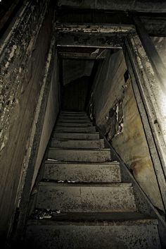 an old set of stairs leading up to the light at the end of the tunnel