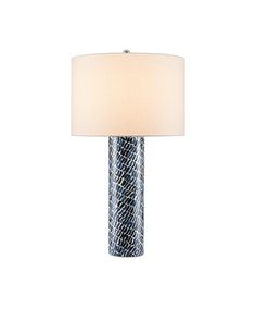 a table lamp with a white shade on it and a blue snake skin pattern design