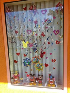 the window is decorated with hearts and other decorations