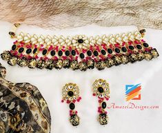 Black Kundan Tumble Moti Choker Necklace Earrings Set - Available to be shipped for FREE from Canada to US, Canada, Australia, New Zealand, Norway, Europe and everywhere else. Explore more BRIDAL SETS, INDIAN JEWELRY SETS 📦 Unmatched FREE Worldwide Shipping ⭐️⭐️⭐️⭐️⭐️ 5 Star Customer Reviews Baljit, USA ⭐️⭐️⭐️⭐️⭐️ My experience with Amazel Designs was perfect the earrings are great. I loved how shipping was quick and they were packed really good. Ramandeep, USA ⭐️⭐️⭐️⭐️⭐️ Thank you Amazel Desig Handmade Black Temple Jewelry, Handmade Black Jewelry For Festivals, Heavy Black Jewelry For Gift, Handmade Black Jewelry For Wedding, Black Temple Jewelry For Ceremonial Occasions, Heavy Black Temple Jewelry, Heavy Black Jewelry Gift, Traditional Black Ceremonial Jewelry, Moti Choker Necklace