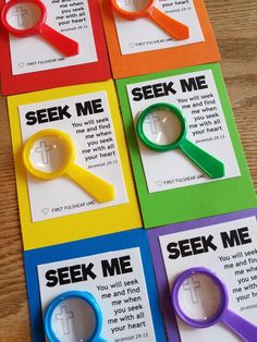 four cards with magnifying glasses and the words seek me