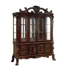 an antique china cabinet with glass doors and carvings on the front, in dark wood