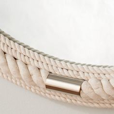 a close up of a rope with a metal handle