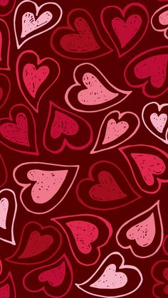 many hearts are arranged in the shape of heart shapes on a dark red background with pink and