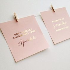 two pieces of pink paper with gold foil on them that say, don't ever let anyone pull your smile sparkle