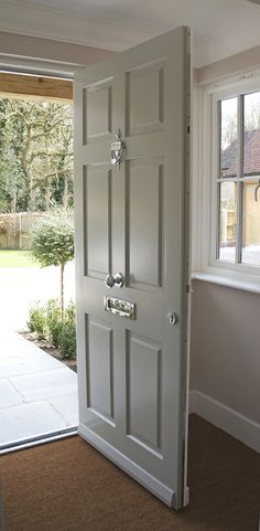 an open door leading to a patio area