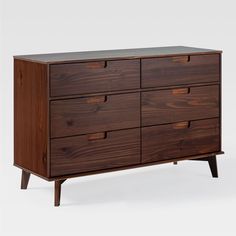 the chest of drawers is made from wood and has six drawers on one side, with two