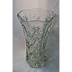 a glass vase sitting on top of a white table