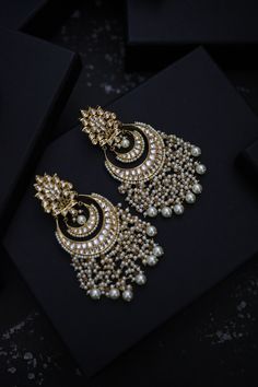 This beautifully handcrafted earrings is set in silver and copper alloy and plated with 22k gold. DETAILS Length - 7.5 cm Closure - Push Back STYLE TIP We love teaming this with classy chiffon sarees or zari silk sarees. Also looks best when worn with your royal whites, off whites and gold. We recommend styling with pastel solids or floral dresses in peachy pink, pistachio green and pastel blue too. Perfect for them Red weddings or banarasi sarees. This is a perfect solution to your pastel weddi Bollywood Chandbali Earrings For Ceremonies, Handmade Chandbali Bridal Earrings, Fusion Style Chandbali Earrings For Ceremonies, Fusion Style Chandbali Earrings For Ceremonial Occasions, Handmade Chandbali Earrings For Diwali, Silver Bollywood Ceremonial Earrings, Bollywood Style Silver Ceremonial Earrings, Heavy Fusion Earrings For Ceremonial Occasion, Ceremonial Chandbali Danglers With Matching Earrings