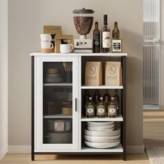 a white cabinet filled with lots of bottles and plates