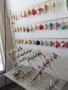 there are many ornaments hanging on the wall