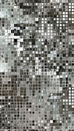 an abstract gray and white mosaic tile pattern with squares in different sizes, all over the surface