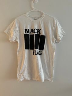 Black Flag white logo t-shirt. Purchased directly from SST Records in the 2000s -- includes rare original 1985 screen print. Like new condition. Tagged mens size M, but please refer to measurements below. **Measurements** Pit to pit - 19.5 inches Top of the collar down the back center - 28 inches *Please note: Vintage and pre-owned items will have small imperfections due to age and wear. I do my best to reflect those in the images and description. Alternative White Band Logo Top, White Alternative Band Logo Top, White Cotton Band Merch Shirt, Cheap White Flag Print T-shirt, Black Flag Band, White Punk Band Logo T-shirt, Black Flag, Flag Shirt, Flag Tshirt