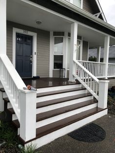 a front porch with steps leading up to the door