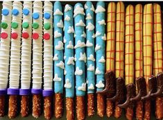 many different types of candy sticks are lined up