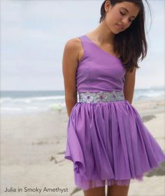 One shoulder taffeta dress with gathered skirt and glitter floral waist detailing. Perfect for any bat mitzvah, school formal, or any other event in your life. Free standard shipping on orders $100 or more*. Shop stellamlia.com for tween and teen party dresses. Bridesmaid Dress With Full Skirt For Prom Season, Spring Prom Dress With Full Skirt, Summer Prom Dress With Full Skirt, Chic Full Skirt Prom Season Dress, Chic Full Skirt Dresses For Prom Season, Summer Party Dress With Full Skirt, Chic Purple Prom Dresses, Purple Mini Dress For Bridesmaid In Summer, Summer Bridesmaid Dresses With Full Skirt