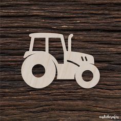 a wooden cutout of a tractor