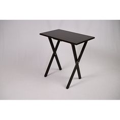 a small black table sitting on top of a white floor