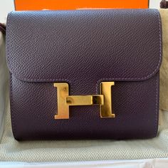 100% Authentic Brand New In Box With Dust Bag; Never Used Anemone Color Sold Out Everywhere Luxury Tan Wallets For Gift, Luxury Tan Wallet As Gift, Luxury Purple Rectangular Wallet, Elegant Purple Wallet For Gift, Luxury Wallets With Gold-tone Hardware As Gift, Hermes Bolide, Hermes Wallet, Duck Bag, Mandarina Duck