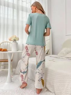 Elevate your comfort with our Floral Print Tee And Pants Pajama Set. Experience the joy of our exquisite cartoon and floral patterns, beautifully complemented by a delicate knot detail. Designed for relaxation, this 2-piece set features a round neck, short sleeves, and a regular fit. Crafted from high-quality knitted fabric with medium stretch, it offers both style and ease. Specifications: Pattern Type: Cartoon, Floral Type: Pant Sets Neckline: Round Neck Details: Knot Sleeve Length: Short Slee Tropical Patterns, Floral Type, Short Pj Set, Pant Sets, Graphic Top, Tropical Pattern, Pajama Set Women, Print Tee, Stretch Pants