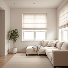 a living room filled with furniture and a large window