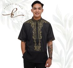 A black Barong Tagalog with unique embroidery can make a bold fashion statement at formal occasions. Here are some content ideas to describe this stylish traditional Filipino garment: The black Barong Tagalog with unique embroidery is a perfect blend of sophistication and traditional style. The intricate embroidery on the garment makes it stand out from the usual Barongs, giving you a unique and refined look. The black fabric of the Barong Tagalog provides a loose & comortable effect while the embroidery adds an element of texture, creating a timeless piece that is perfect for any formal event. The embroidery is carefully crafted with intricate details that showcase the artistry and skill of the Filipino craftsmen. Each stitch is made with precision and care, resulting in a masterpiece tha Barong Tagalog Outfit Men, Black Barong Tagalog, Black Barong, Barong Tagalog, Filipino Culture, Unique Embroidery, Intricate Embroidery, Content Ideas, Look Plus