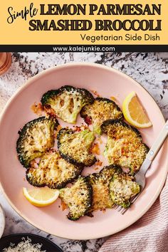 a pink plate topped with broccoli covered in lemon parmesan smashed broccoli