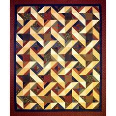 a quilt made with different colors and shapes