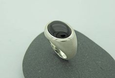 Elegant, simple silver ring with transversely aligned onyx in oval cabochon cut and beautiful dark black. Onyx oval 12 x 16mm All ring sizes are available. Please write your ring size in the comment field by checking out. On the following link, you will find the ring with a larger stone 20 x 15mm https://www.etsy.com/de/listing/228065410/grosser-onix-ring-in-silber-925?ref=shop_home_active_17 Modern Oval Cabochon Signet Ring For Formal Occasions, Modern Oval Cabochon Signet Ring As Gift, Modern Oval Cabochon Signet Ring For Gift, Modern Oval Cabochon Dome Ring, Minimalist Oval Cabochon Signet Ring For Formal Occasions, Minimalist Oval Cabochon Signet Ring For Formal, Black Cabochon Signet Ring For Formal Occasions, Formal Black Oval Cabochon Signet Ring, Modern Dome Ring With Oval Cabochon For Formal Events