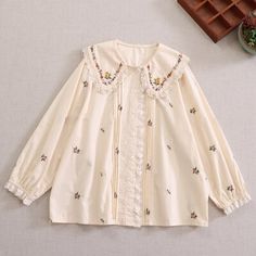 Material: Polyester Measurement cm in Shoulder 40 15.75 Bust 124 48.82 Sleeve 56 22.05 Length 67 26.38 Spring Cream Blouse With Doll Collar, Cotton Long Sleeve Blouse With Floral Embroidery, Casual Spring Blouse With Collar, Cute Pink Top With Cute Collar, Casual Blouse With Floral Embroidery Collar, Pink Cotton Tops With Doll Collar, Pink Doll Collar Top For Spring, Feminine Peter Pan Collar Top For Spring, Cute Cotton Fall Blouse