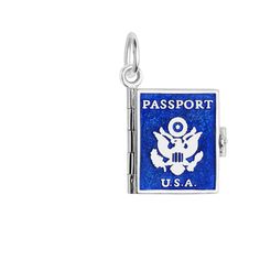 a blue passport charm with an american flag on the front and white letters that read, u s a