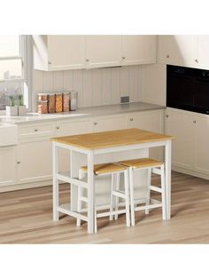 a kitchen table with two stools in front of it and an oven on the other side