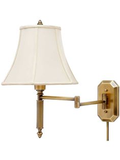 a wall light with a white shade on the arm and a lamp attached to it